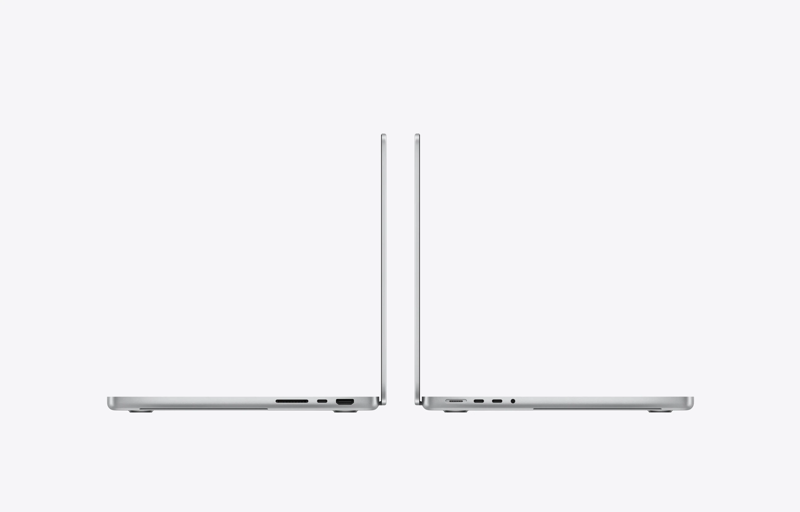 14-inch MacBook Pro laptops, side exteriors, open, silver colour, right-side ports: SDXC card slot, Thunderbolt 4 and HDMI, left-side ports: MagSafe 3, two Thunderbolt 4, headphone jack, thin profile, rounded raised feet